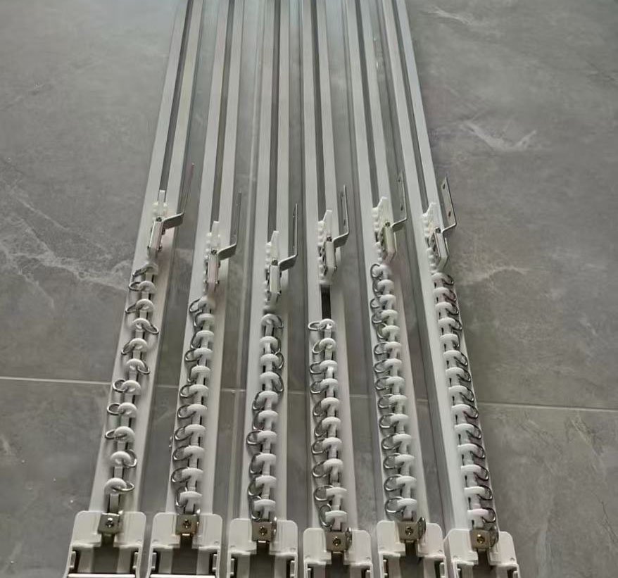A close-up inspection of a curtain track's finish and profile