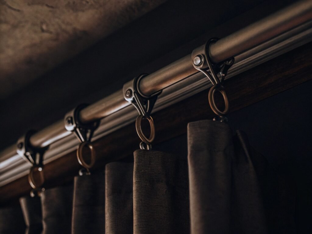 A close-up of different types of heavy-duty wall anchors, like toggle bolts and concrete anchors