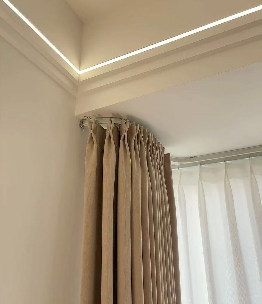 An overhead view of a curved track used to create a patient privacy area in a healthcare setting