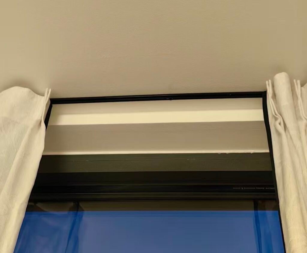 A close-up shot showing the texture and durability of a matte black powder-coated aluminum track.