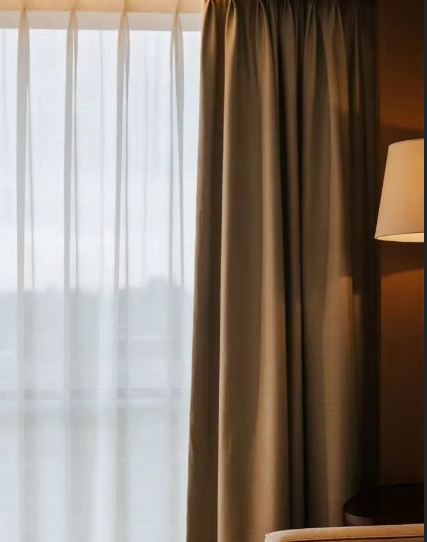 a luxury hotel room with a discreet recessed curtain track