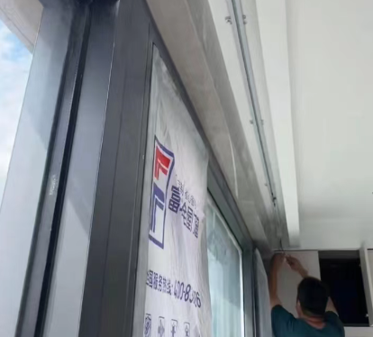 two people shaking hands in front of factory shelving