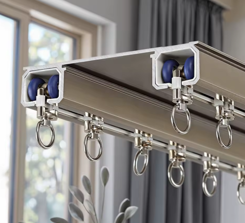 Seamless Curtain Track for Oversized Window A long, seamless curtain track being installed across an expansive, oversized hotel window, emphasizing its single-piece construction.