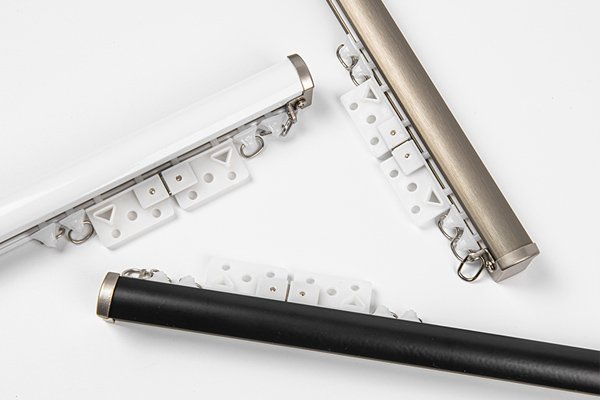 Ceiling vs. Wall Mount for Hotel Design A split-screen view: one side shows a sleek recessed ceiling track, the other a classic decorative wall rod.